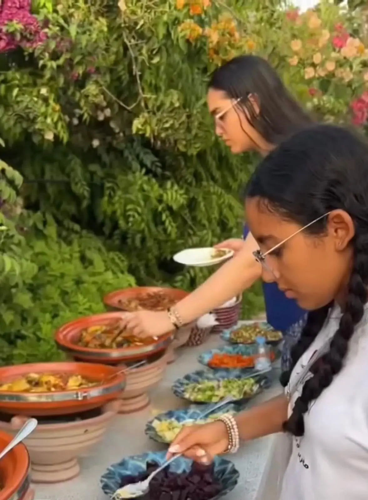 Guests sharing Moroccan tagines at Dar Cherfa