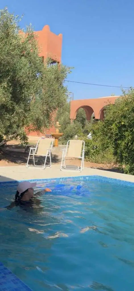 Children playing together beside the swimming pool at Dar Cherfa