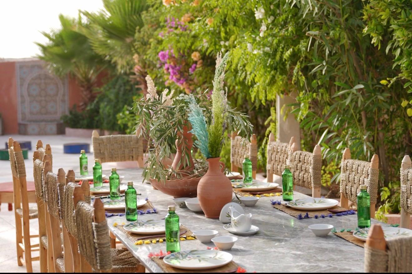 Long garden table set for a Moroccan meal at Dar Cherfa